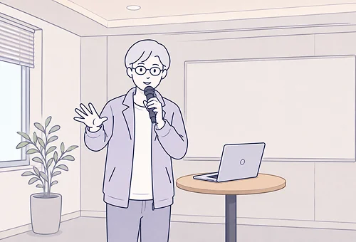 ノートPCを持ってプレゼンする人のイラスト